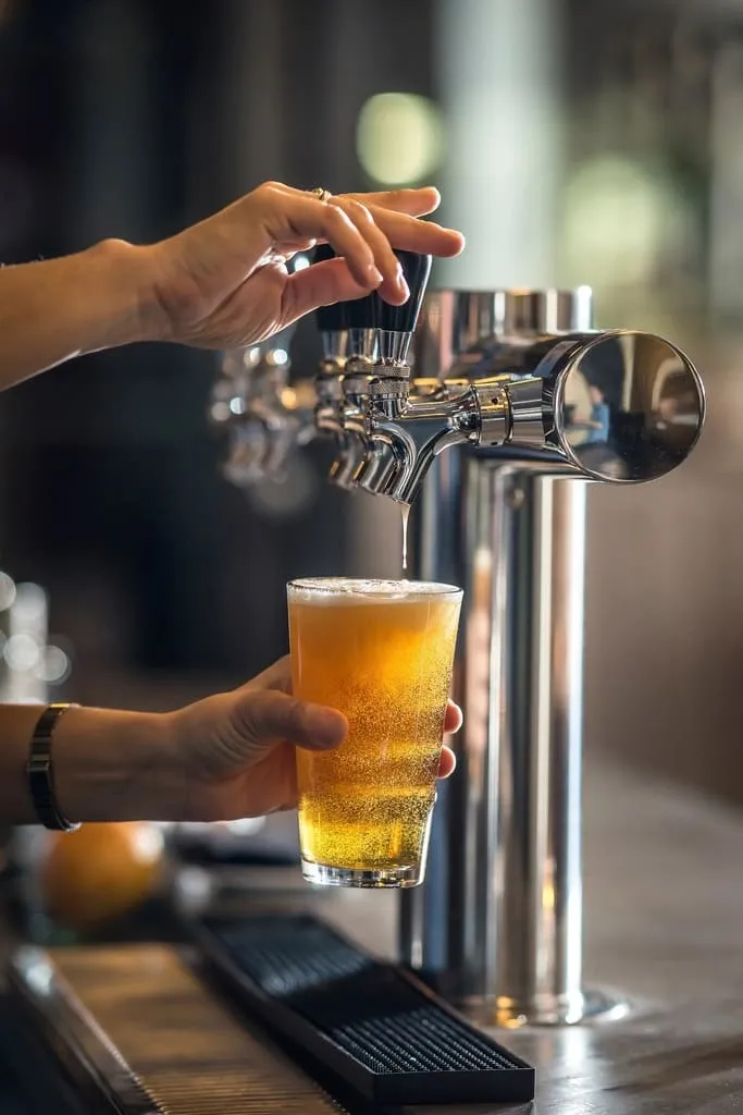 A pint mid-pour at the taps