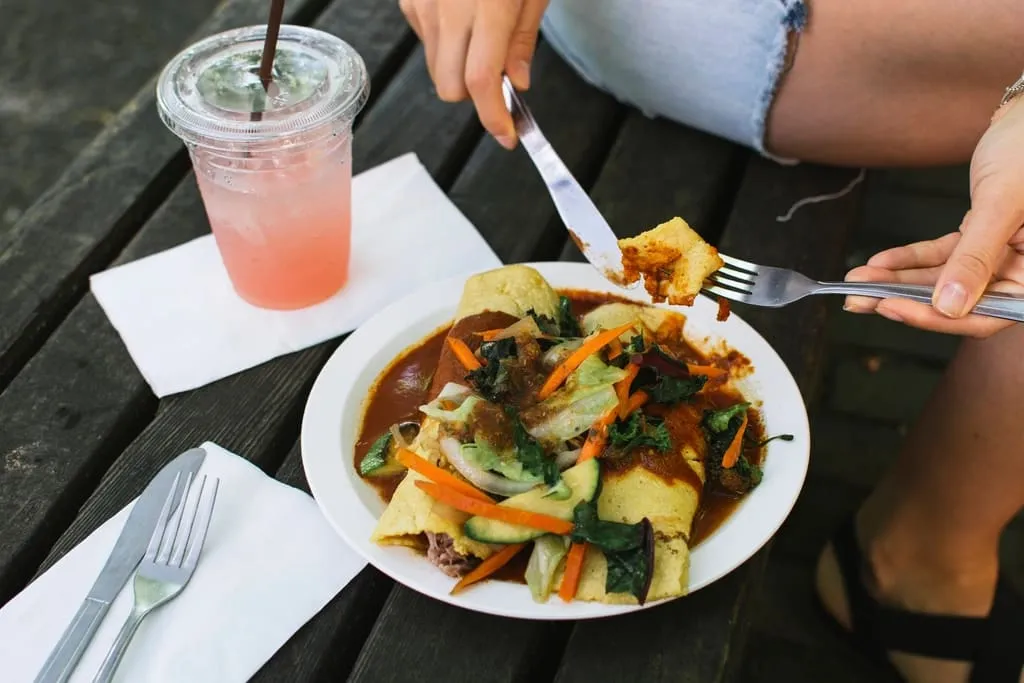 Enchiladas with tomatillo salsa and shaved vegetables